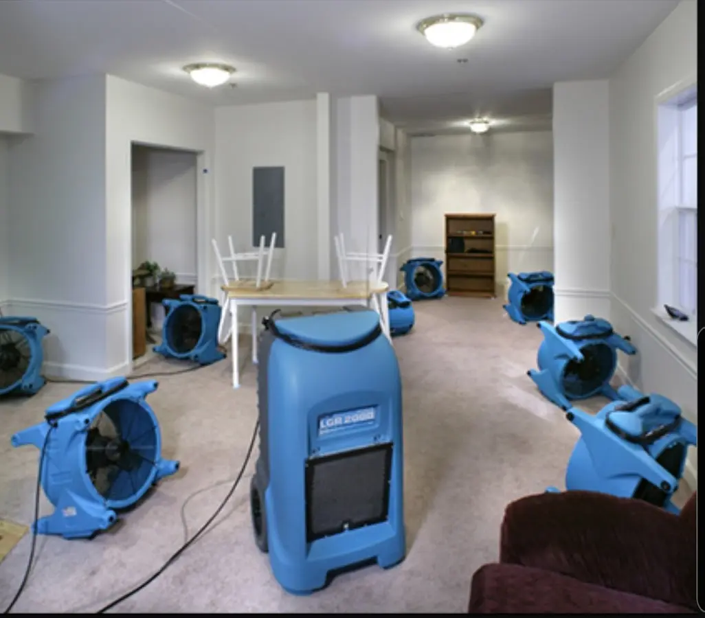 Air movers and dehumidifier setup for Water Damage Restoration in Dover